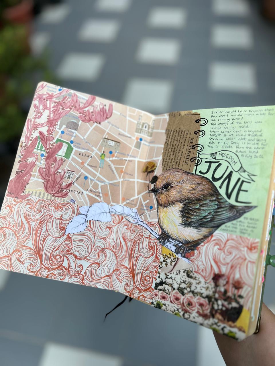 Original paper collage with a bird, a map and delicate pink flowers