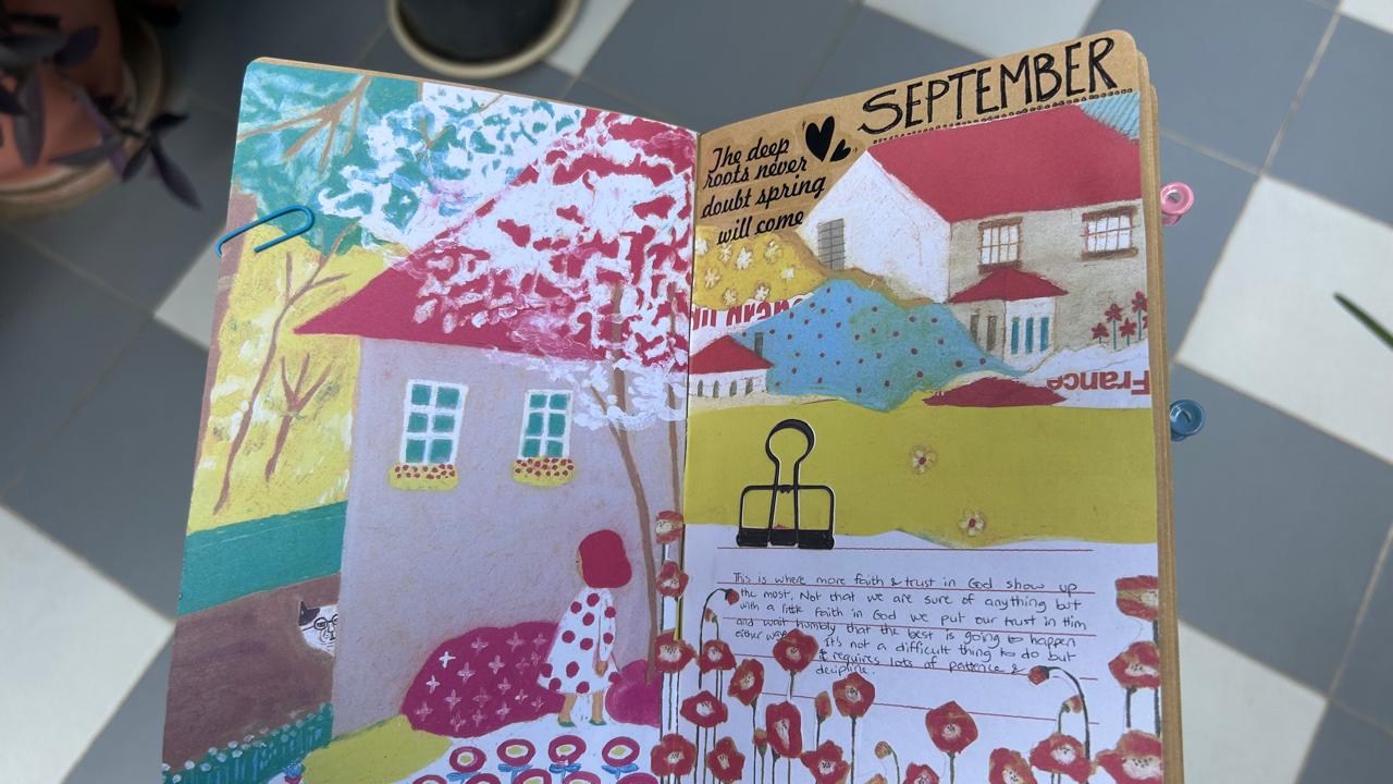 September collage with little houses and colourful paper flowers